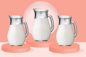 three pitchers filled with heavy cream