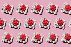 Pattern of rows of folded dollar bills with red gift bows