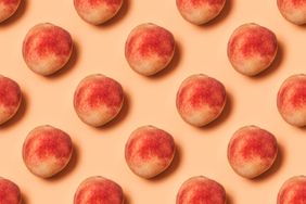 pattern of peaches on a pastel background. Flat lay, top view.