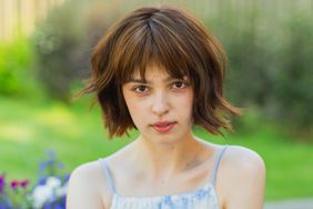 bob haircut on a woman outdoors in a sundress
